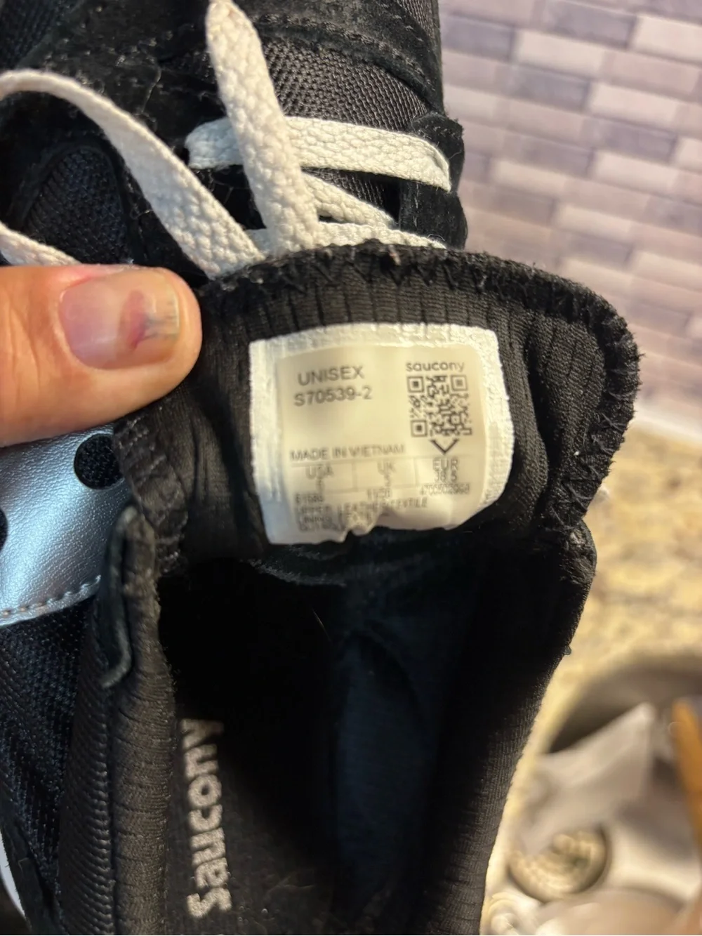 Saucony Black and Silver Retro Runner Sneakers